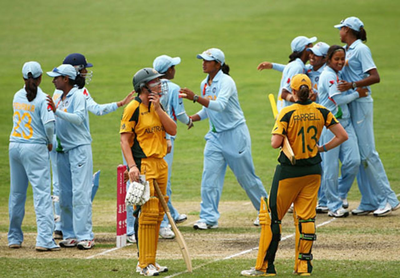 Lauren Ebsary and Rene Farrell wear a dejected look as the Indian team celebrates in the background, Australia v India, Super Six, women's World Cup, Sydney, March 14, 2009