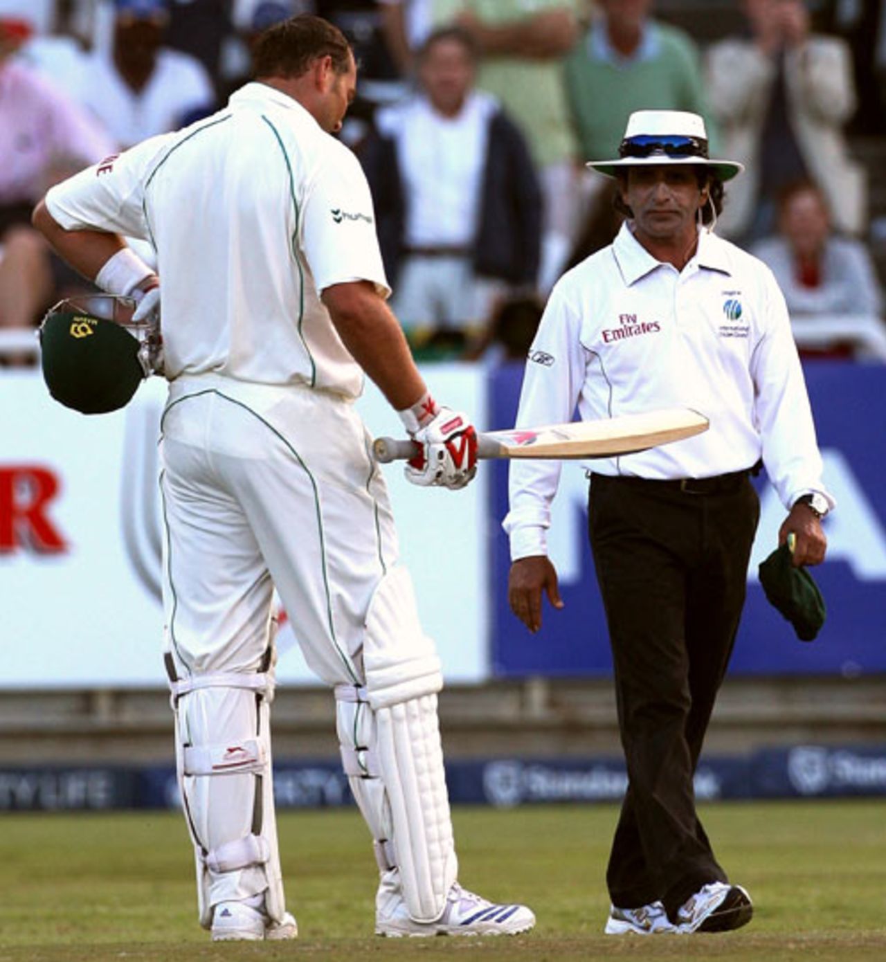 Jacques Kallis explains to Asad Rauf that he inside-edged the ball after a single he took on 99 was ruled a leg-bye, South Africa v Australia, 3rd Test, 2nd day, Cape Town, March 20, 2009