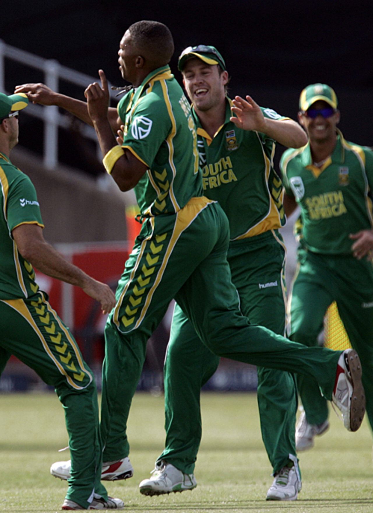 Team-mates rush in to congratulate Makhaya Ntini on removing Michael Clarke, South Africa v Australia, 1st ODI, Durban, April 3, 2009