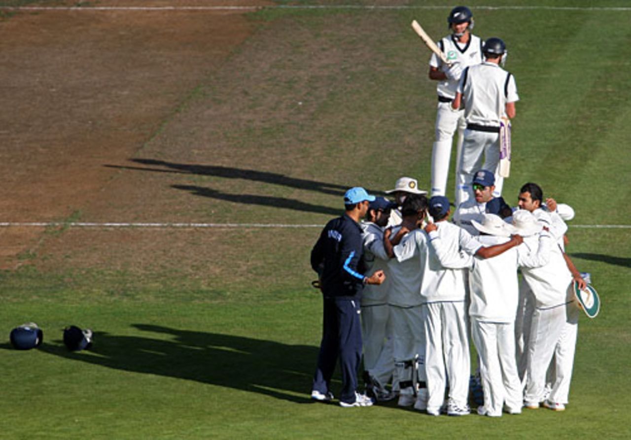 The Indian players huddle after a wicket, New Zealand v India, 3rd Test, Wellington, 2nd day, April 4, 2009