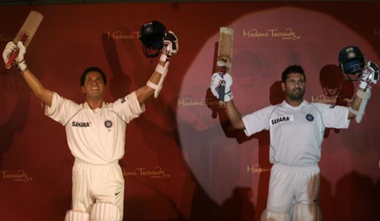 Sachin Tendulkar poses next to his wax replica in Mumbai, April 13, 2009