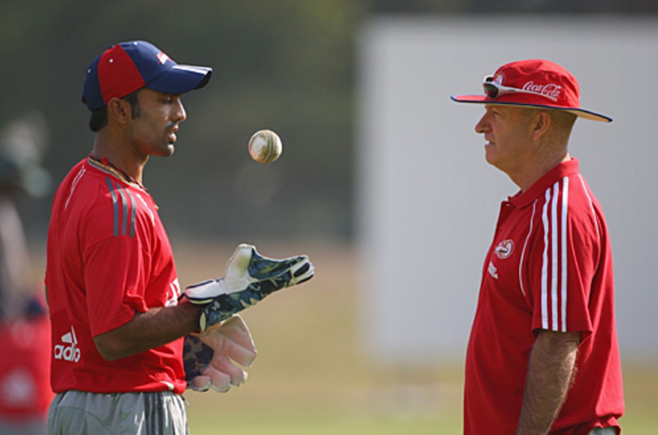 Greg Shipperd discusses a point with Dinesh Karthik at the nets, Cape Town, April 17, 2009