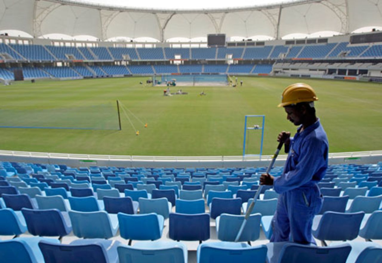 A worker cleans the stands a day before the Australia against Pakistan ODI at the new Sport City, Dubai, April 21, 2009