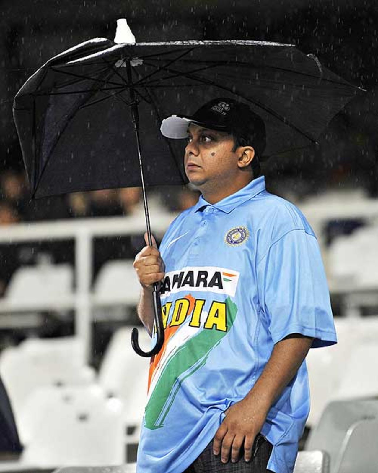 An Indian fan waits in vain for the game to start, Chennai Super Kings v Kolkata Knight Riders, IPL, 13th match, Cape Town, April 25, 2009
