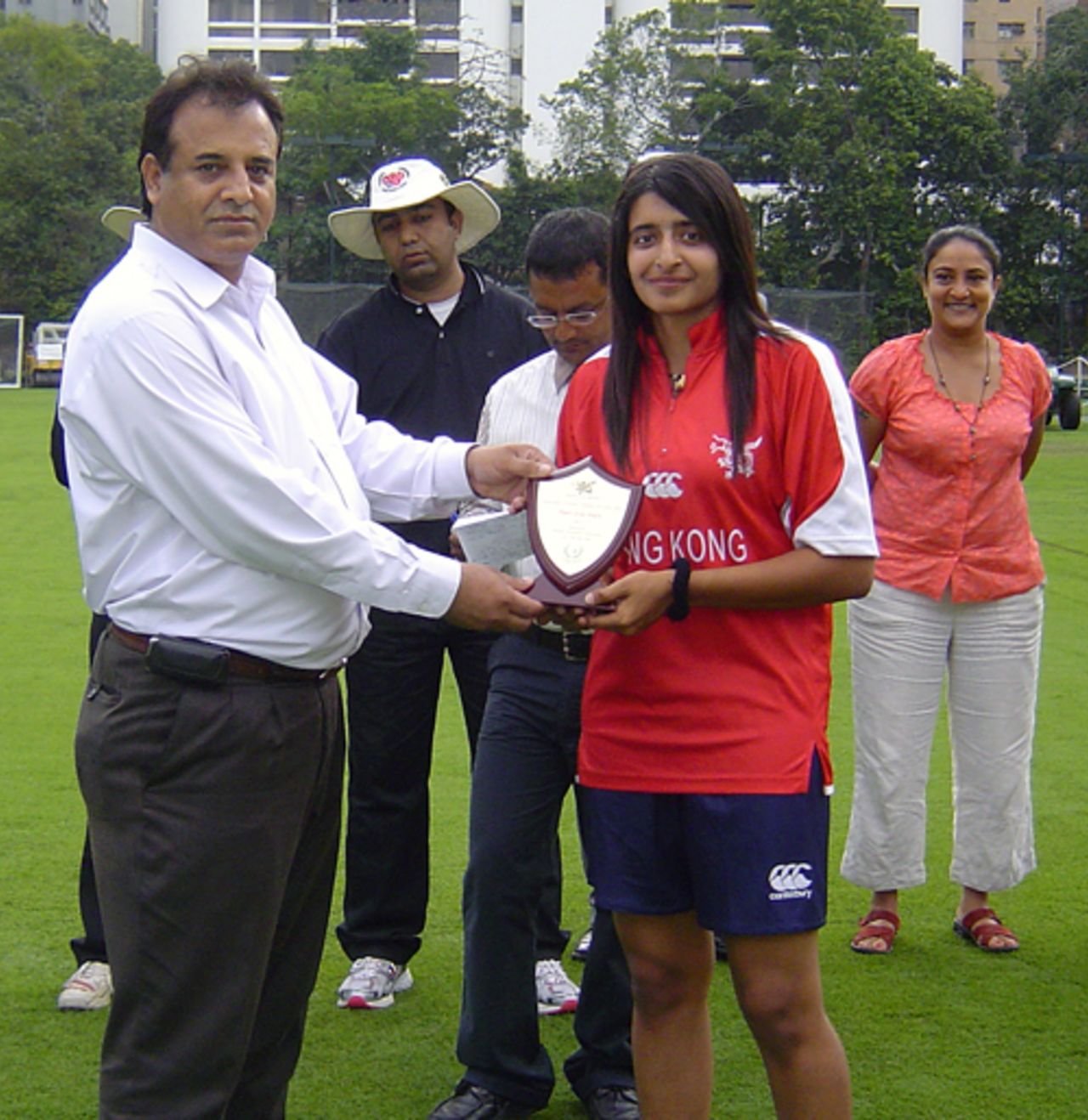 ong Kong's Keenu Gill receives her Player of the Match award against Pakistan 'A' Women at Kowloon Cricket Club