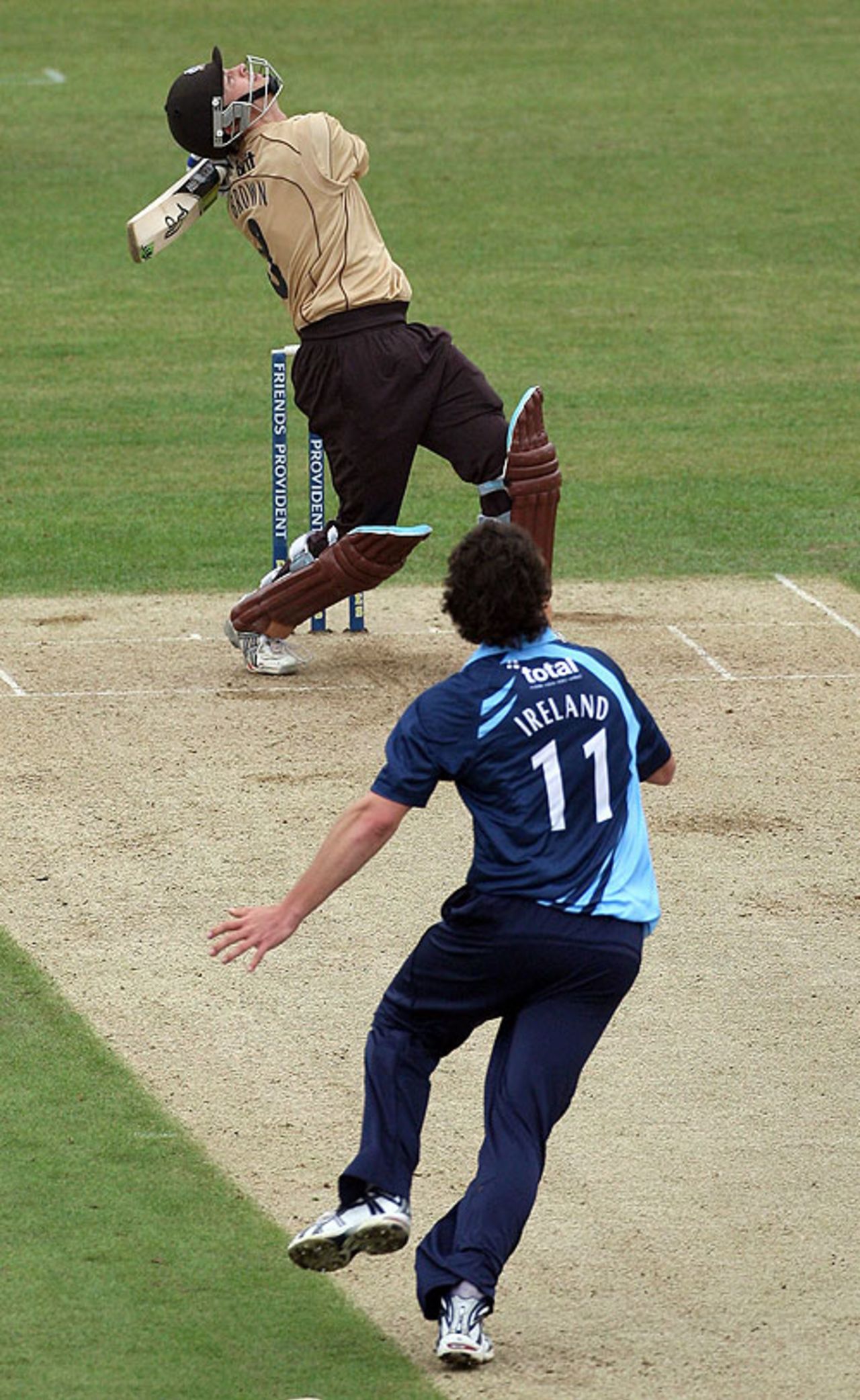 Michael Brown has a swipe and Anthony Ireland prepares to take the return catch, Surrey v Gloucestershire, Friends Provident Trophy, The Oval, May 13, 2009