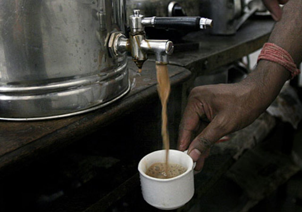 A server pours out coffee at the India Coffee House, Bangalore, May 16, 2008