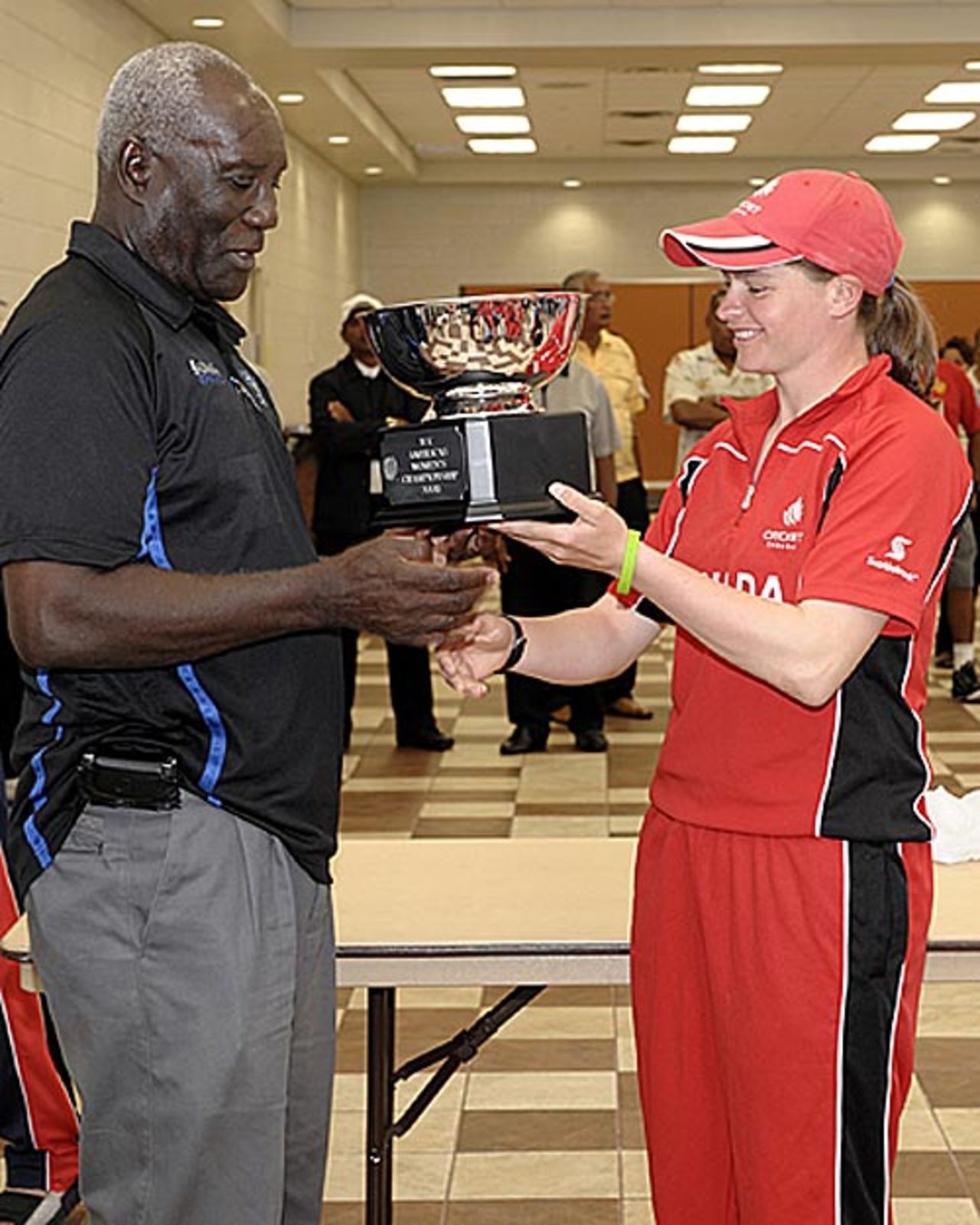 Event co-ordinator Mr.Selwyn Caesar hands the Americas Women's Championship trophy to Canadian captain, Joanna White., Americas Women's Championship 2009, Fort Lauderdale, May 22, 2009