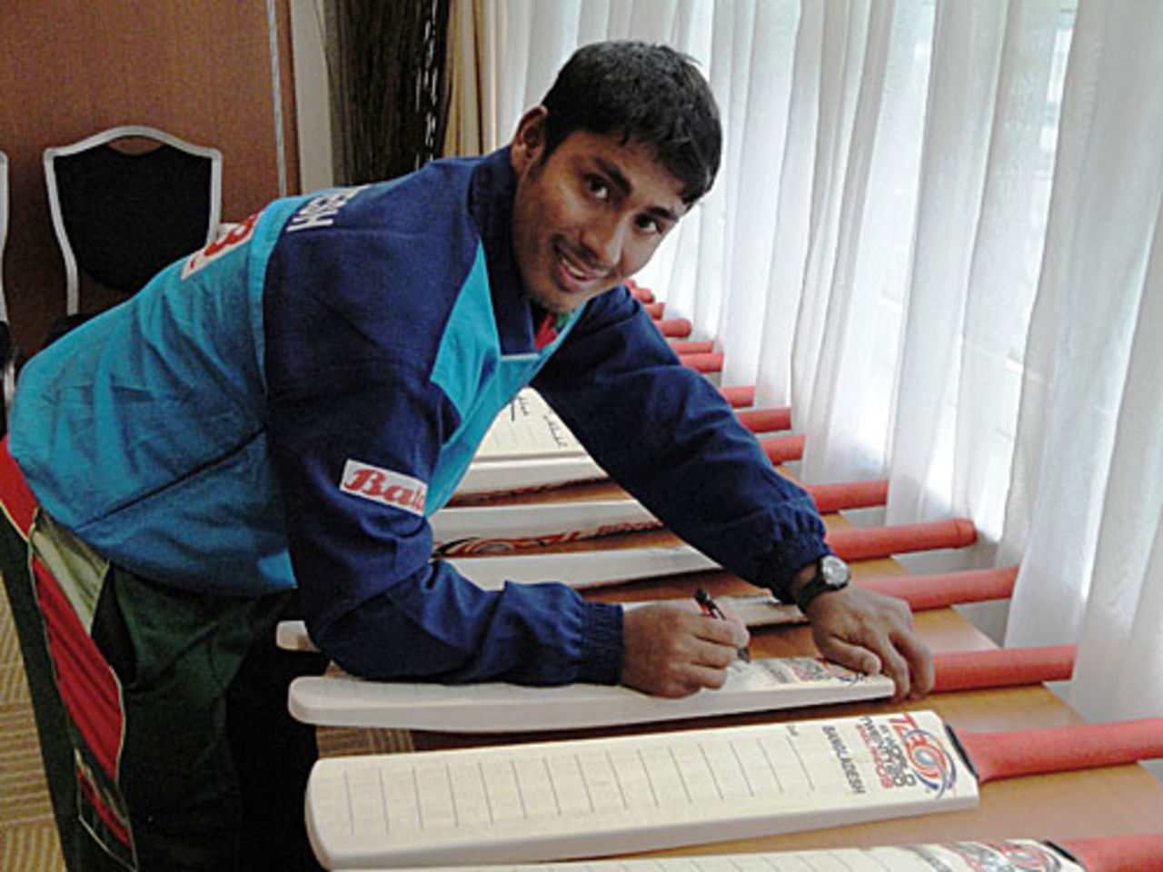 Mohammad Ashraful signs bats at the team hotel, Nottingham, June 3, 2009