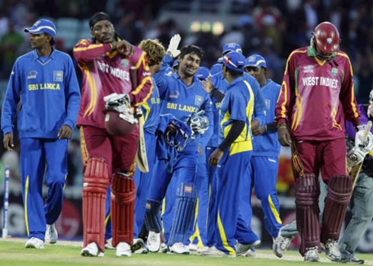 A dejected Chris Gayle walks off as Sri Lanka celebrate the win, Sri Lanka v West Indies, ICC World Twenty20, 2nd semi-final, The Oval, June 19, 2009 