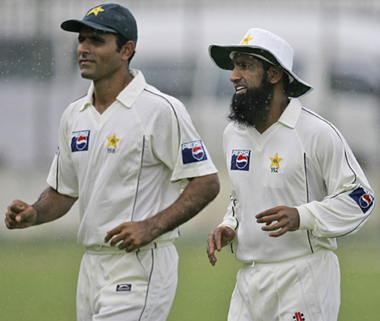Abdul Razzaq and Mohammad Yousuf head back to the pavilion as the heavens open up, Sri Lanka Cricket XI v Pakistanis, Colts Cricket Club Ground, Colombo, June 29, 2009