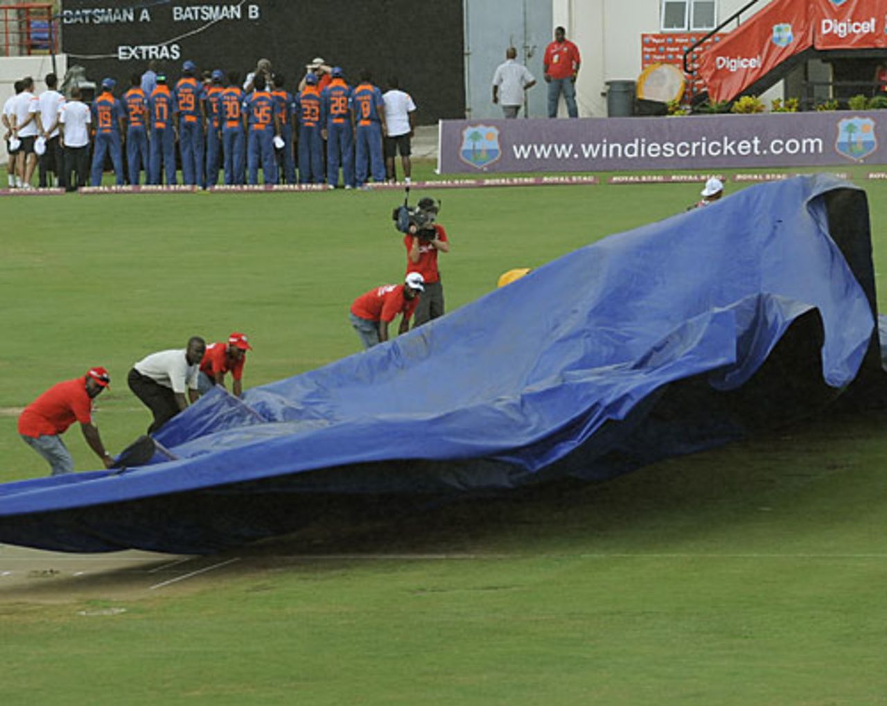 Groundsmen put the covers on the pitch, West Indies v India, 3rd ODI, St Lucia, July 3, 2009