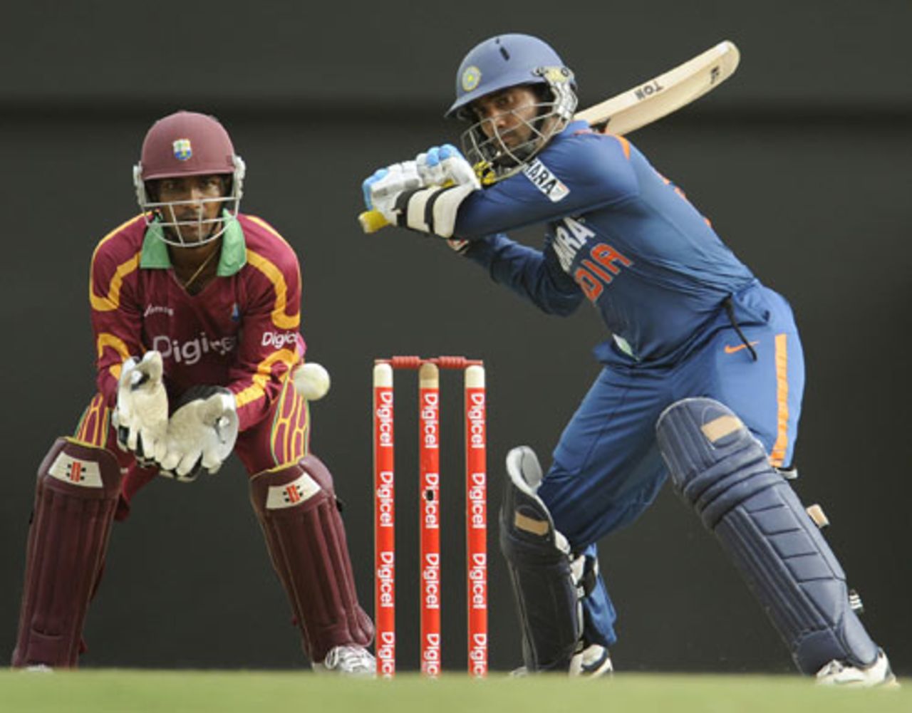 Dinesh Karthik winds up for a big hit, West Indies v India, 3rd ODI, St Lucia, July 3, 2009
