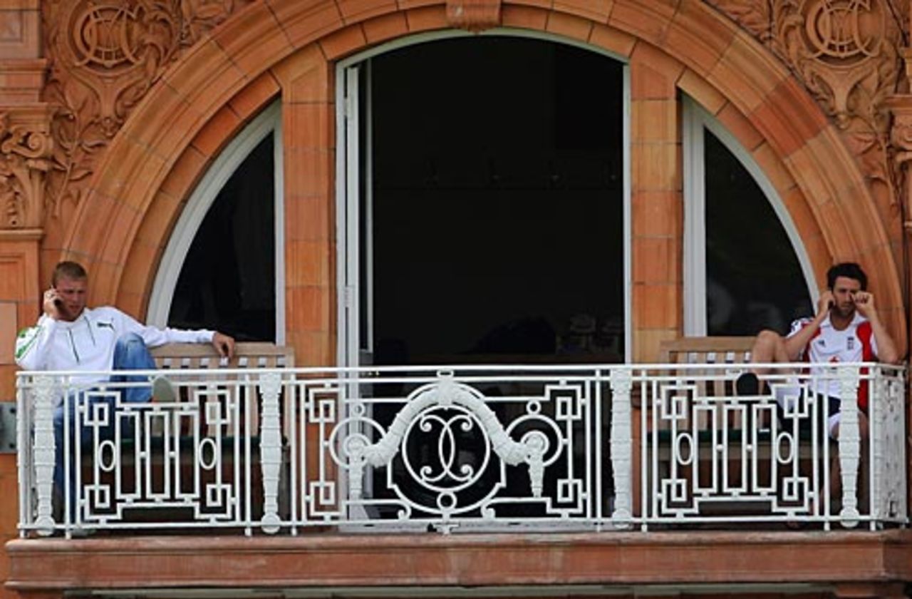 Andrew Flintoff and Graham Onions speak on their phones, Lord's, July 14, 2009