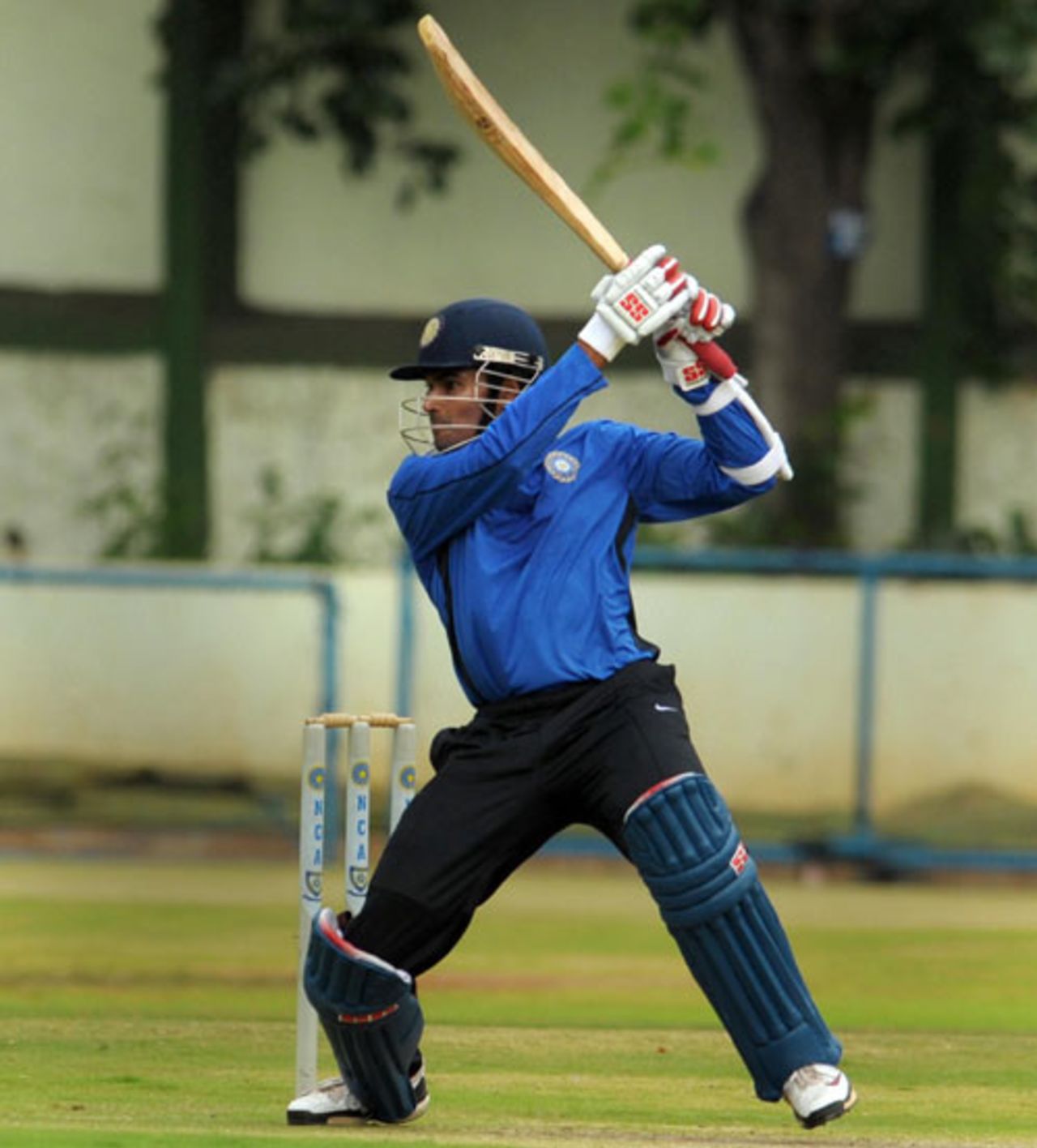 S Badrinath carves the ball towards the off side during a practice session ahead of the Emerging Players' tournament, National Cricket Academy, Bangalore, July 15, 2009