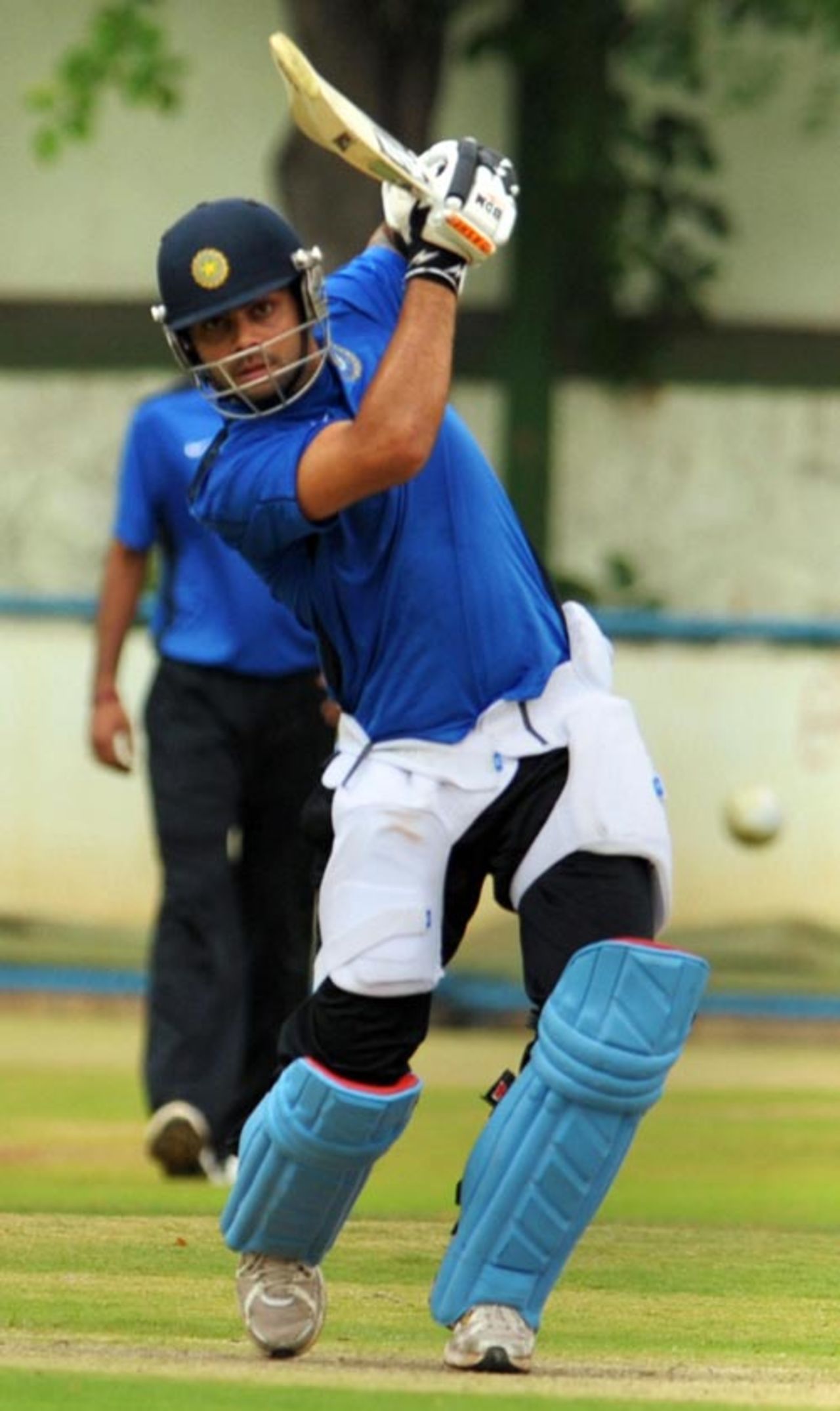 Virat Kohli drives during a practice session ahead of the Emerging Players' tournament, National Cricket Academy, Bangalore, July 15, 2009