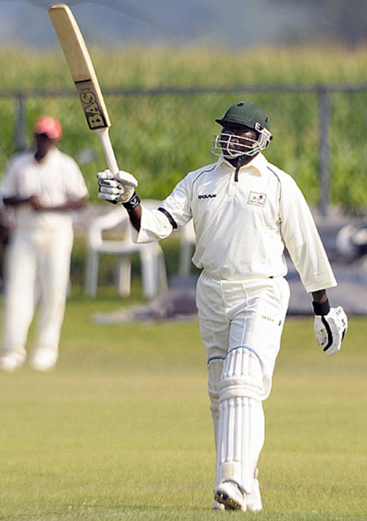 Steve Tikolo raises his bat after his 11th first-class century and second of the match, Canada v Kenya, ICC Intercontinental Cup, King City, 3rd day, August 16, 2009 