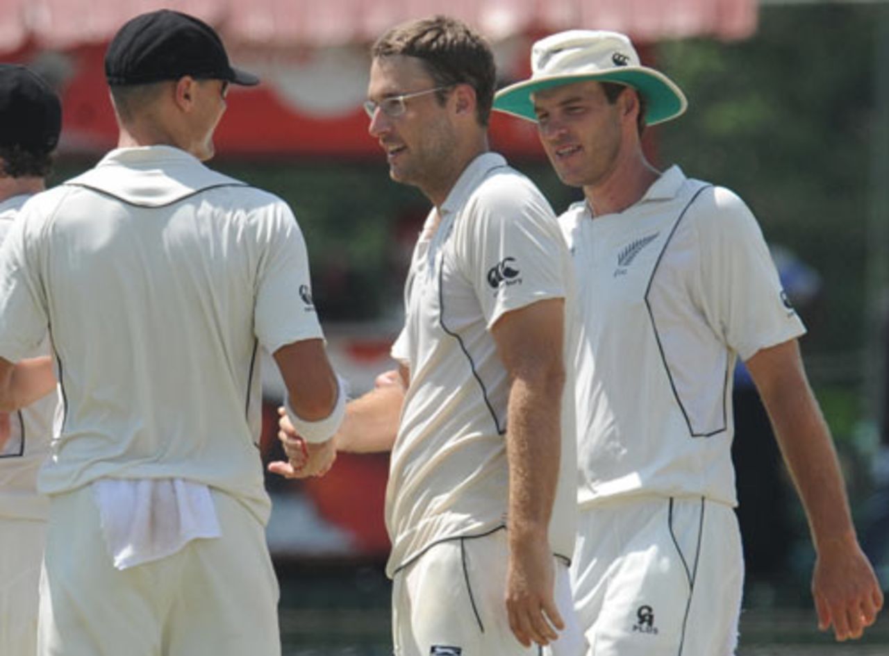 Chris Martin and Tim McIntosh congratulate Daniel Vettori, Sri Lanka v New Zealand, 2nd Test, SSC, Colombo, 1st day, August 26, 2009