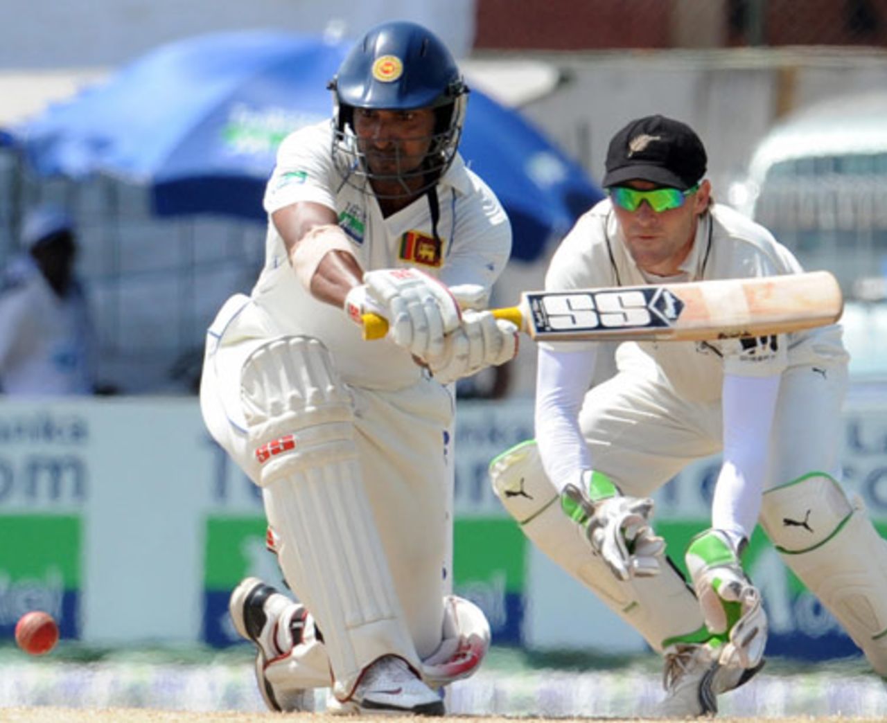 Kumar Sangakkara keeps his eyes on the ball as he readies to sweep, Sri Lanka v New Zealand, 2nd Test, SSC, Colombo, 3rd day, August 28, 2009