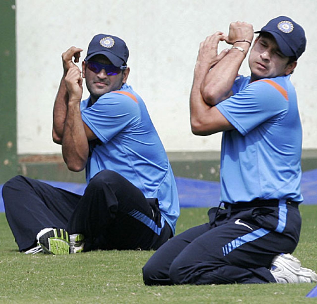 Sachin Tendulkar and MS Dhoni stretch at the National Cricket Academy, Bangalore, August 30, 2009