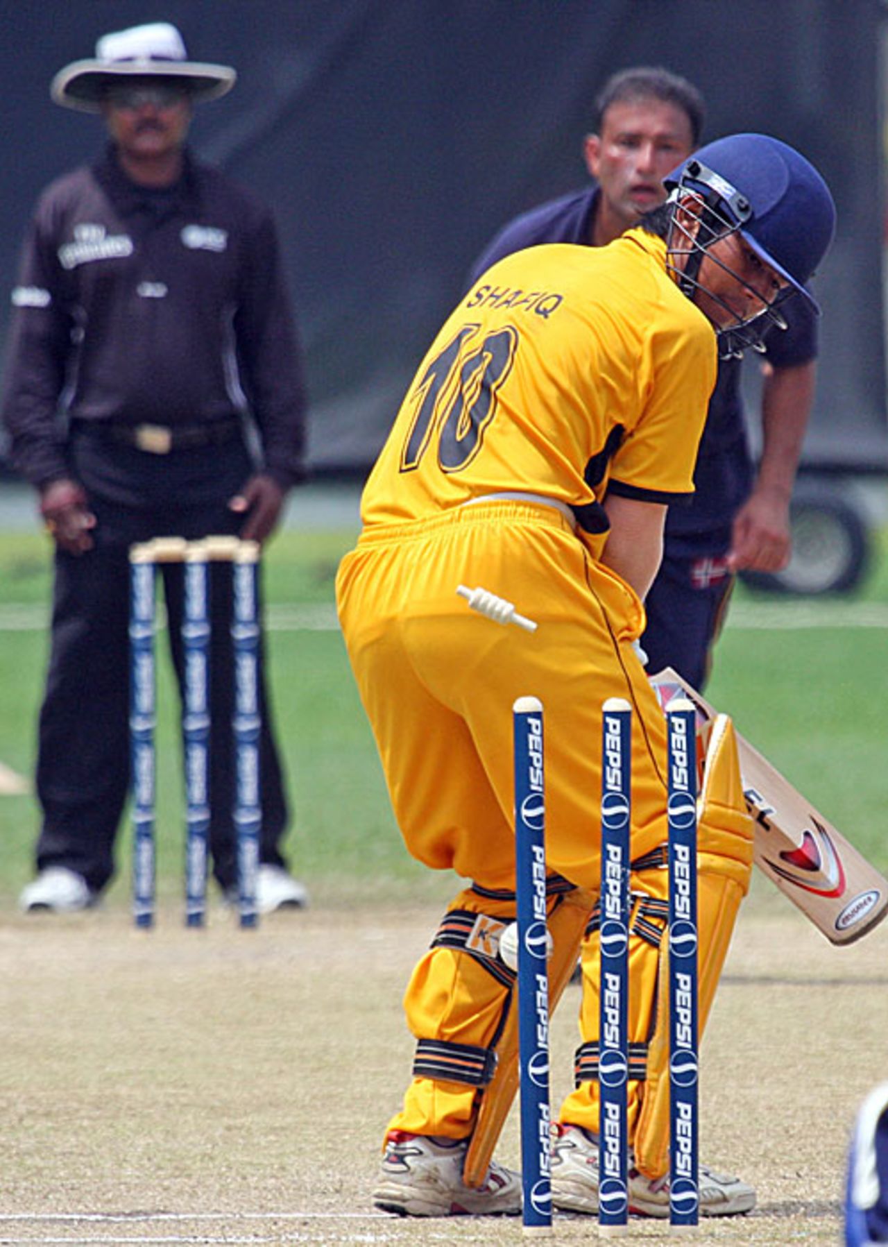 Shafiq Sharif is bowled by Aamer Waheed for 8, Malaysia v Norway, ICC World Cricket League Division 6, Singapore, August 31, 2009 