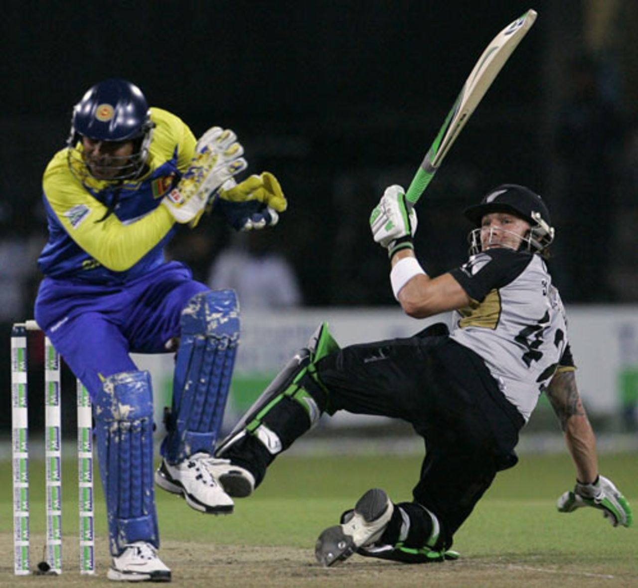 Brendon McCullum falls over after playing a scoop which ricocheted off Kumar Sangakkara's helmet for four, Sri Lanka v New Zealand, 2nd Twenty20, Colombo, September 4, 2009