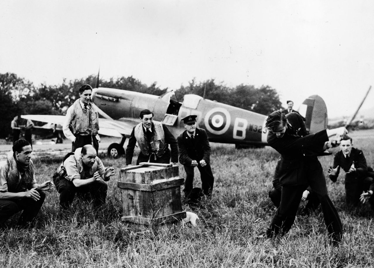 RAF pilots relax with an impromptu game of cricket, June 20, 1941