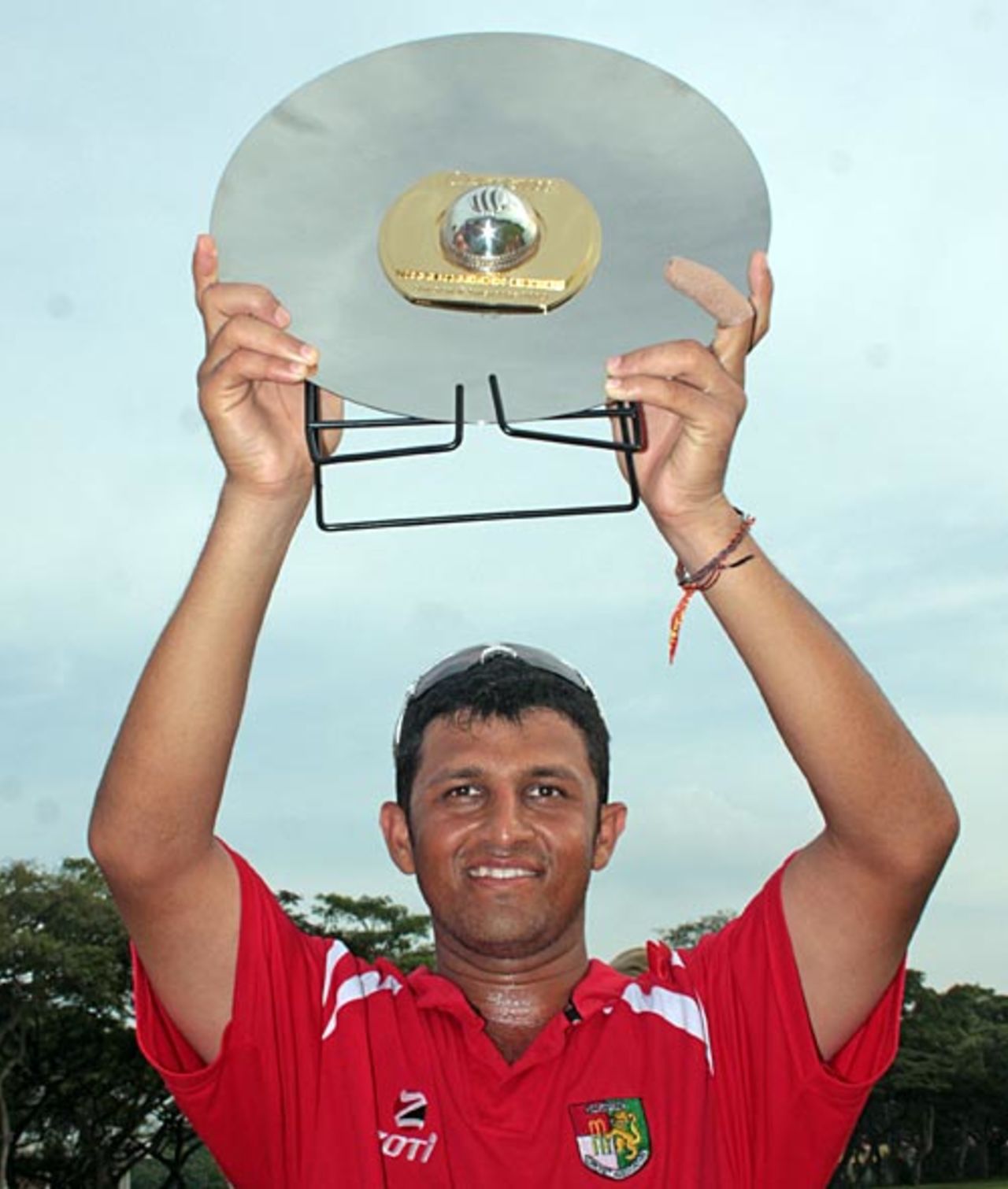 Chetan Suryawanshi, the Singapore captain, with the trophy, Bahrain v Singapore, ICC World Cricket League Division 6, Singapore, September 5, 2009