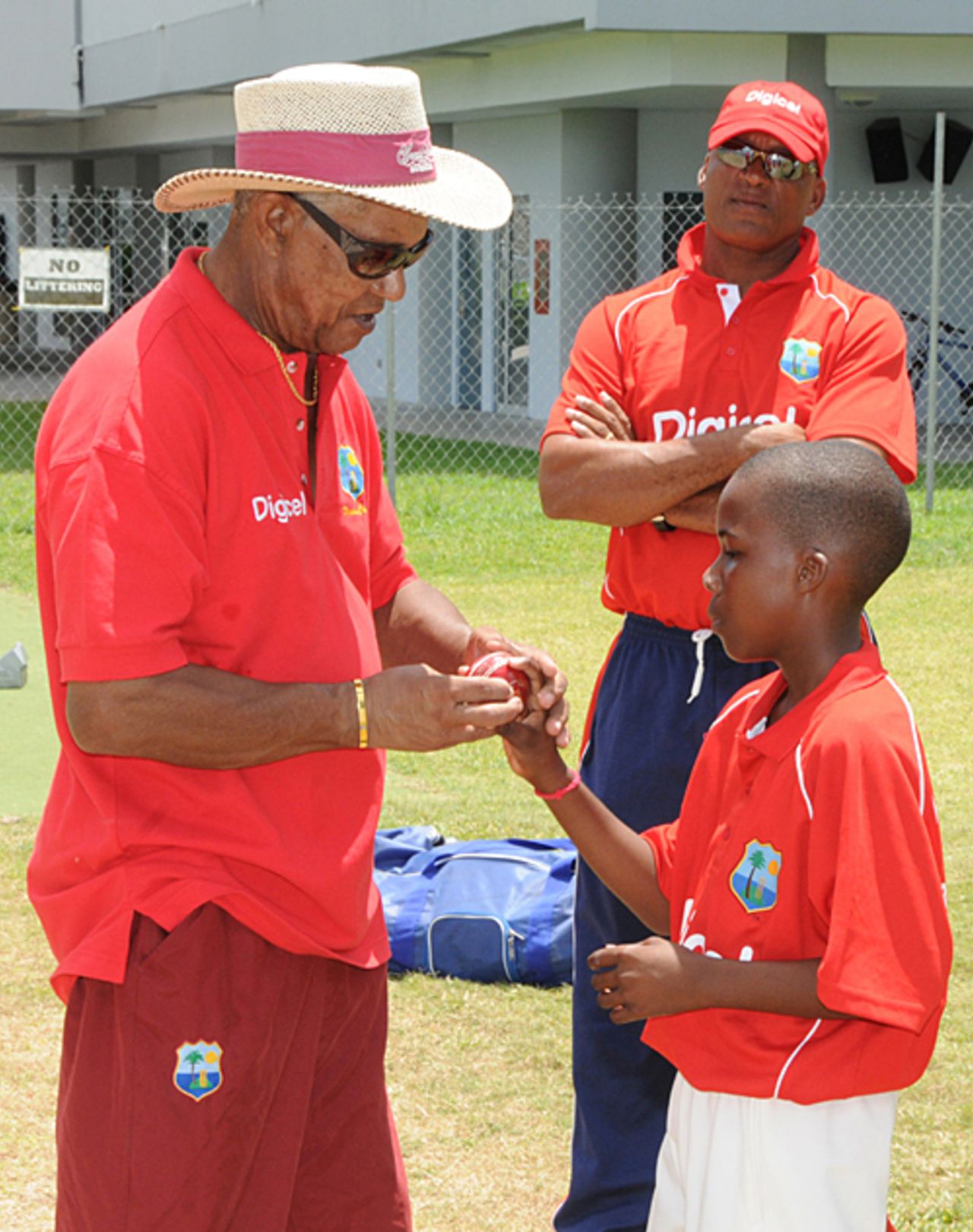 Sir Garry Sobers shows a youngster the proper bowling grip, Barbados, September 7, 2009