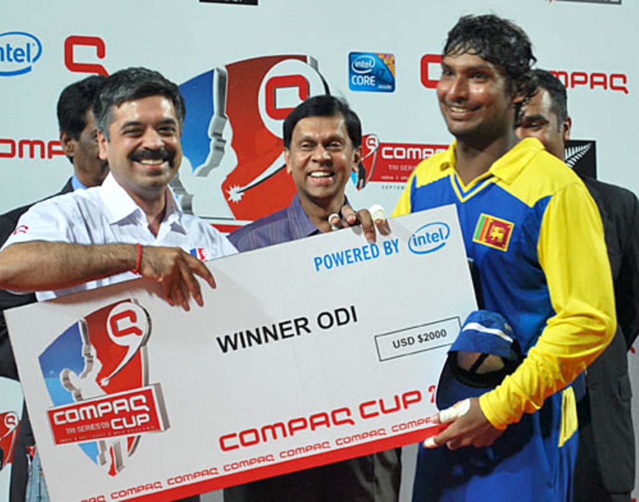 Kumar Sangakkara is all smiles after picking up the winner's cheque, Sri Lanka v New Zealand, 1st match, Compaq Cup, Colombo, September 8, 2009