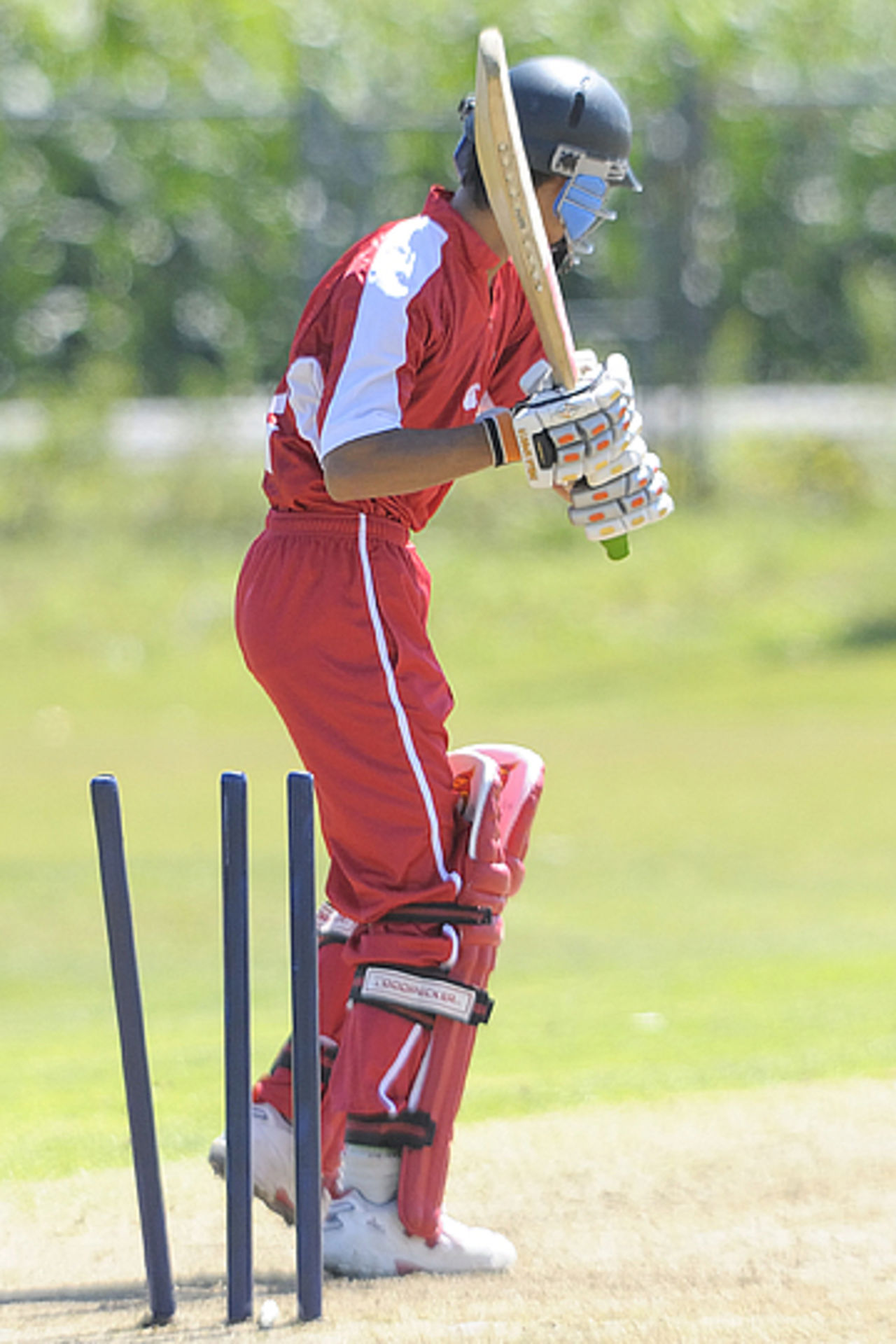 Asif Khan is bowled against PNG at the ICC Under-19 Cricket World Cup Qualifier