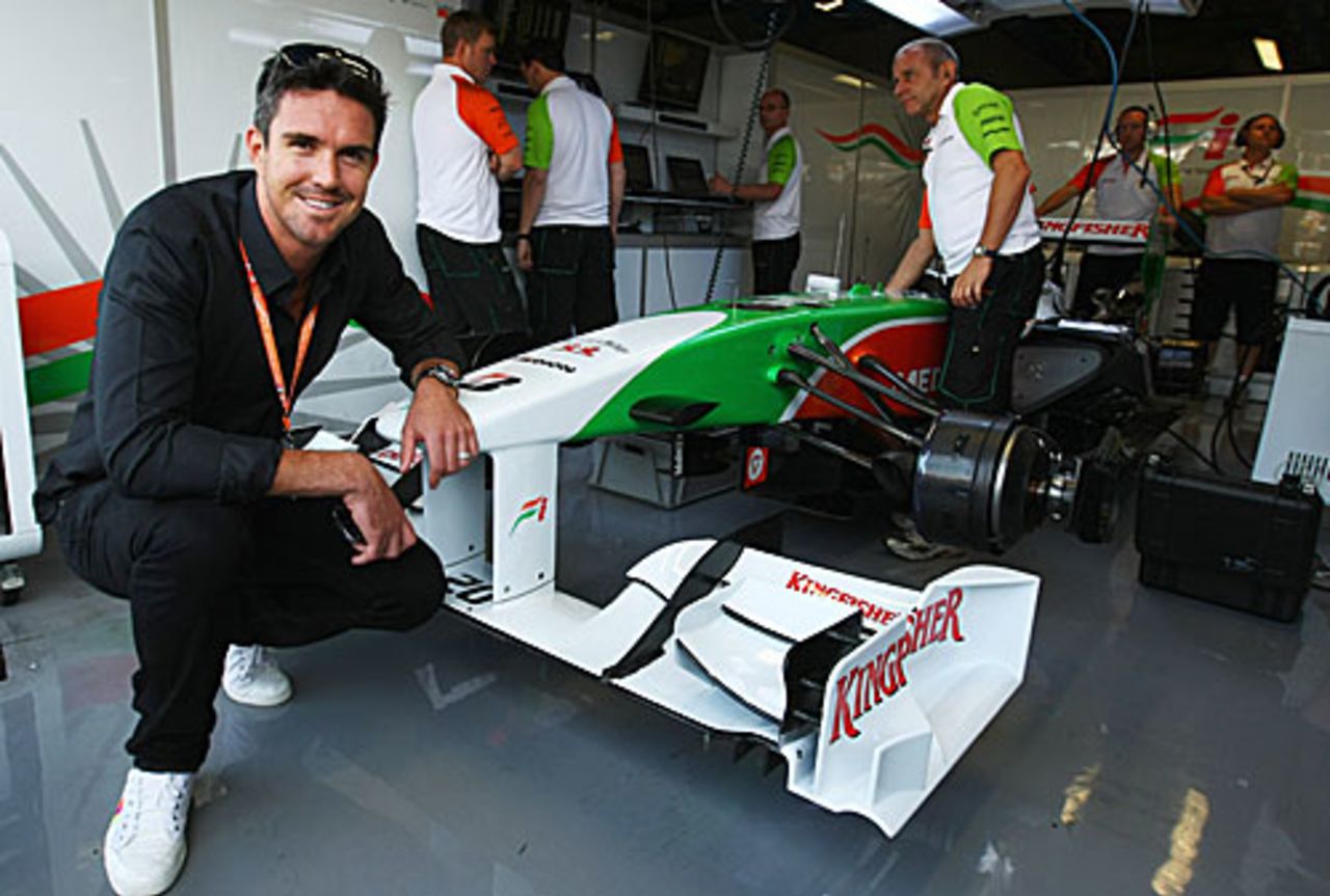Kevin Pietersen poses at the Force India garage at the Italian Grand Prix, Monza, September 13, 2009