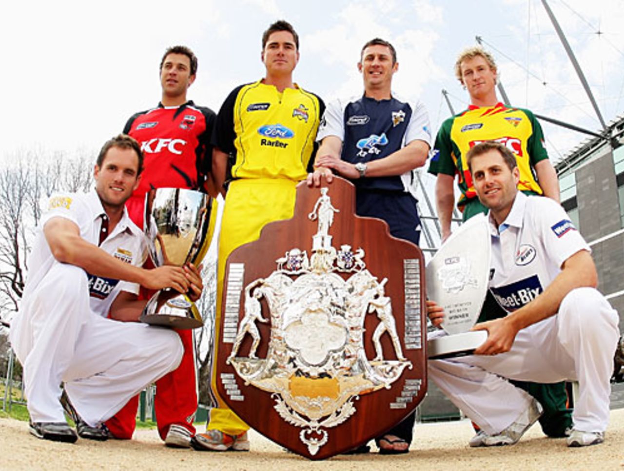 Australian state captains model the new season's uniforms and the domestic trophies, Melbourne