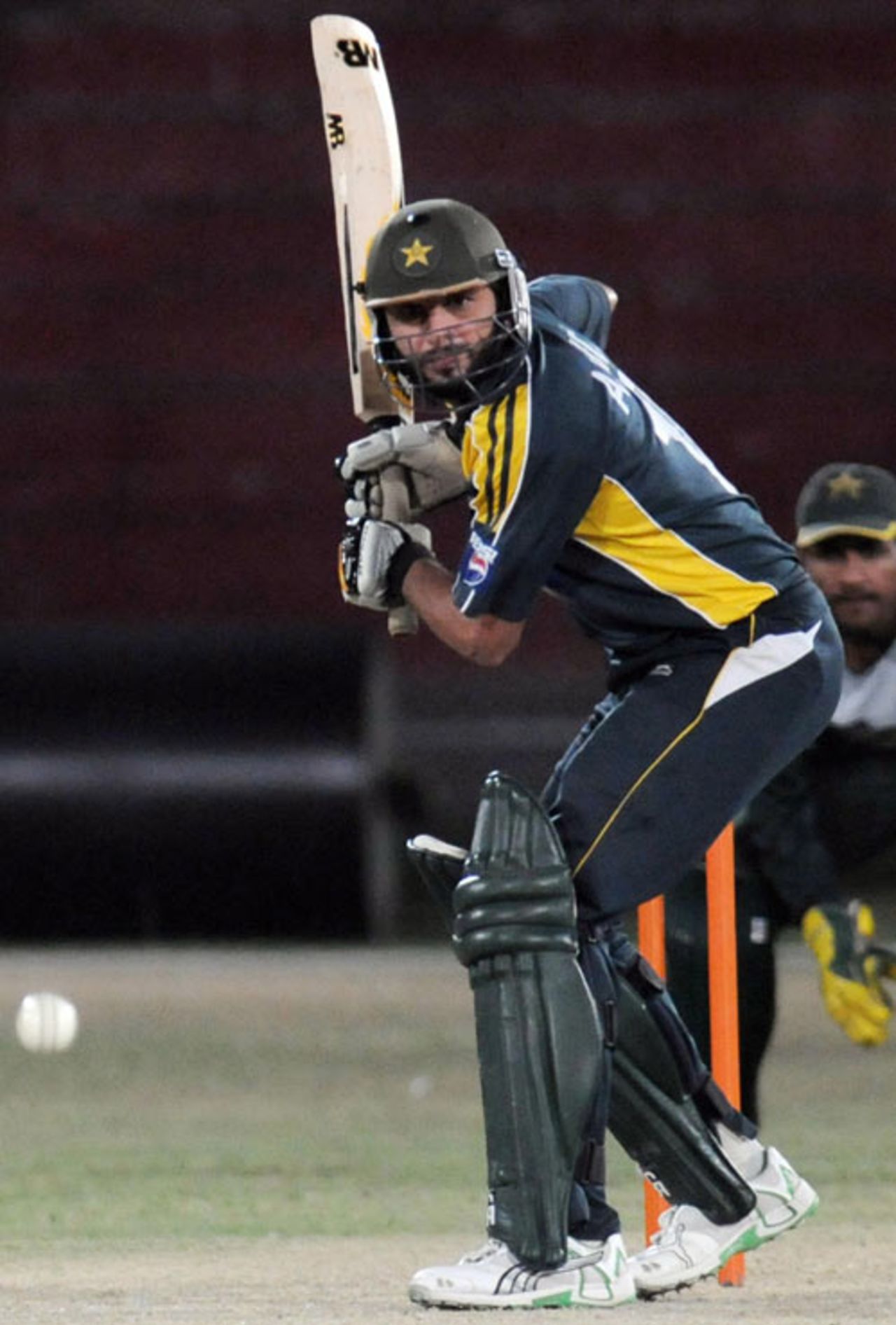 Shahid Afridi gets in position to play a stroke during a training camp, National Cricket Stadium, Karachi, September 16, 2009