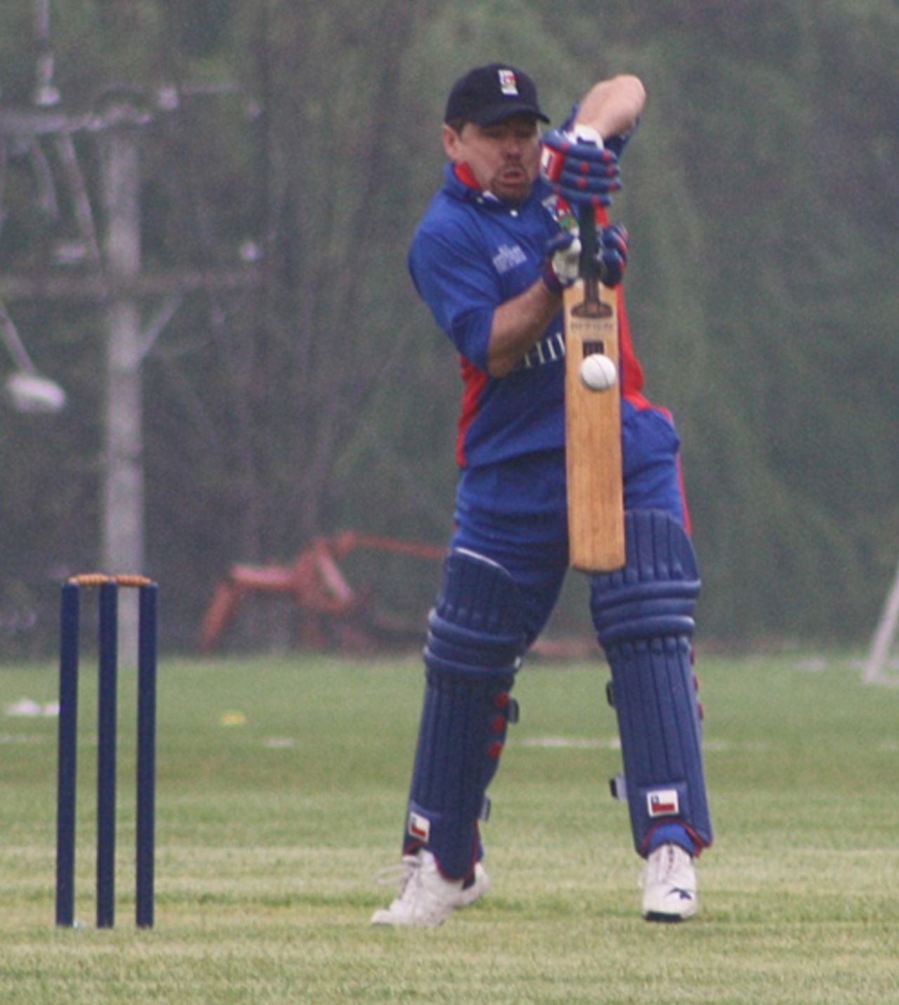 Chile's Ian Walker defends as rain begins to fall, ICC Americas Division 3, Santiago, October 10, 2009