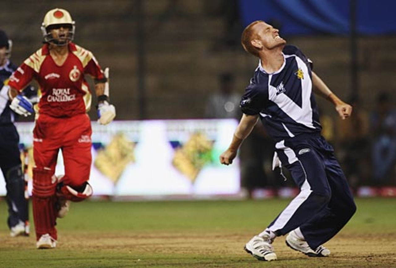 Andrew McDonald celebrates Rahul Dravid's wicket, Bangalore v Victoria, Champions League, League B, Bangalore, October 15, 2009