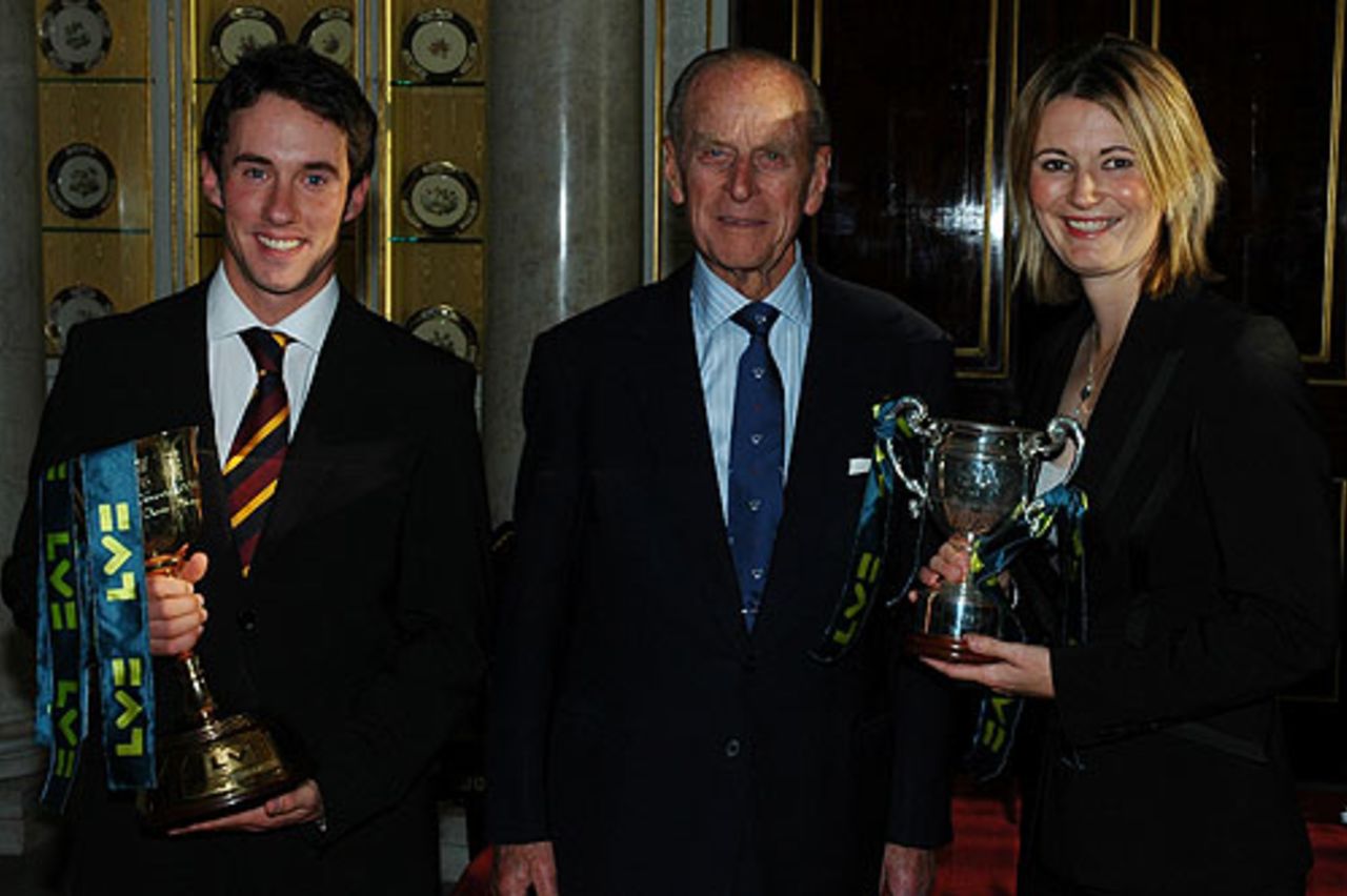 Durham's captain, Will Smith, and Charlotte Edwards, England women's captain, receive the Lord's and Lady Taverners trophies from the Duke of Edinburgh at Buckingham Palace