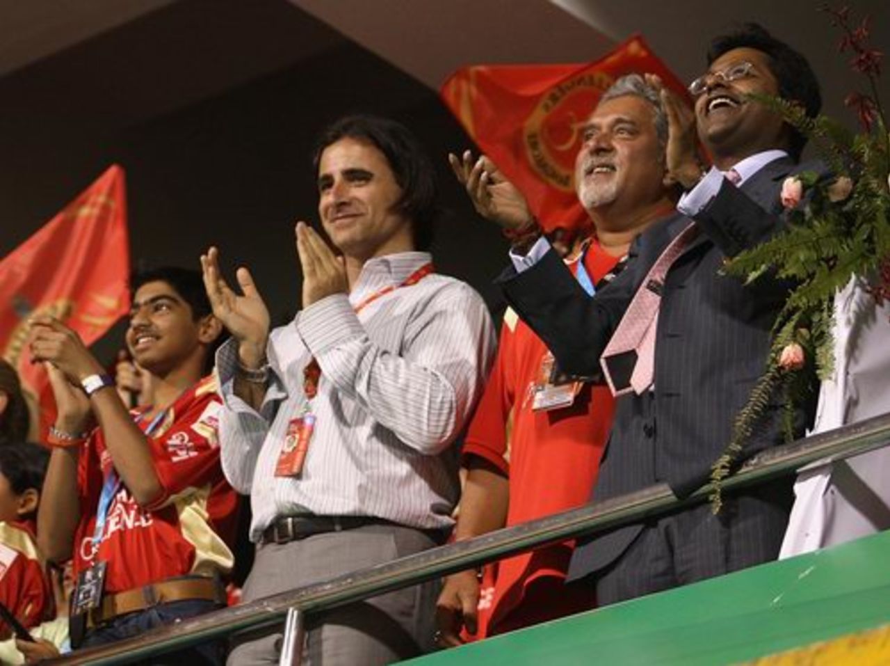 (From left) Dean Kino, head of the Champions League governing council, Bangalore Royal Challengers owner Vijay Mallya, and Lalit Modi, Chairman of the Champions League, applaud the action