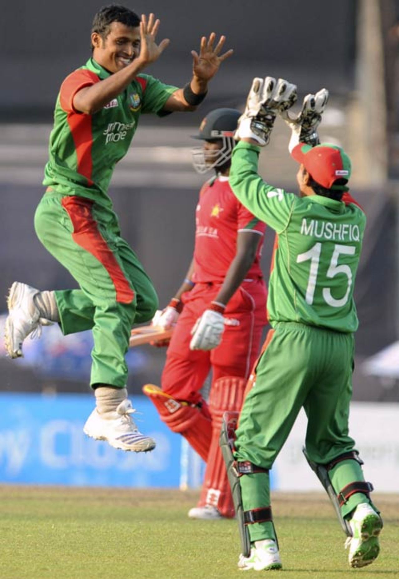 Nazmul Hossain and Mushfiqur Rahim celebrate a wicket, Bangladesh v Zimbabwe, 3rd ODI, Mirpur