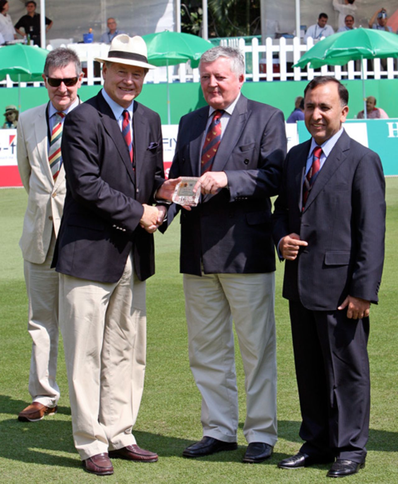 Terry Smith is presented with his HKCA Honorary Life Member Award by ICC President David Morgan at the 2009 Hong Kong Cricket Sixes. Also in the picture is HKCA Hon. Secretary John Cribbin (left) and HKCA President, Capt. Saleem (right)