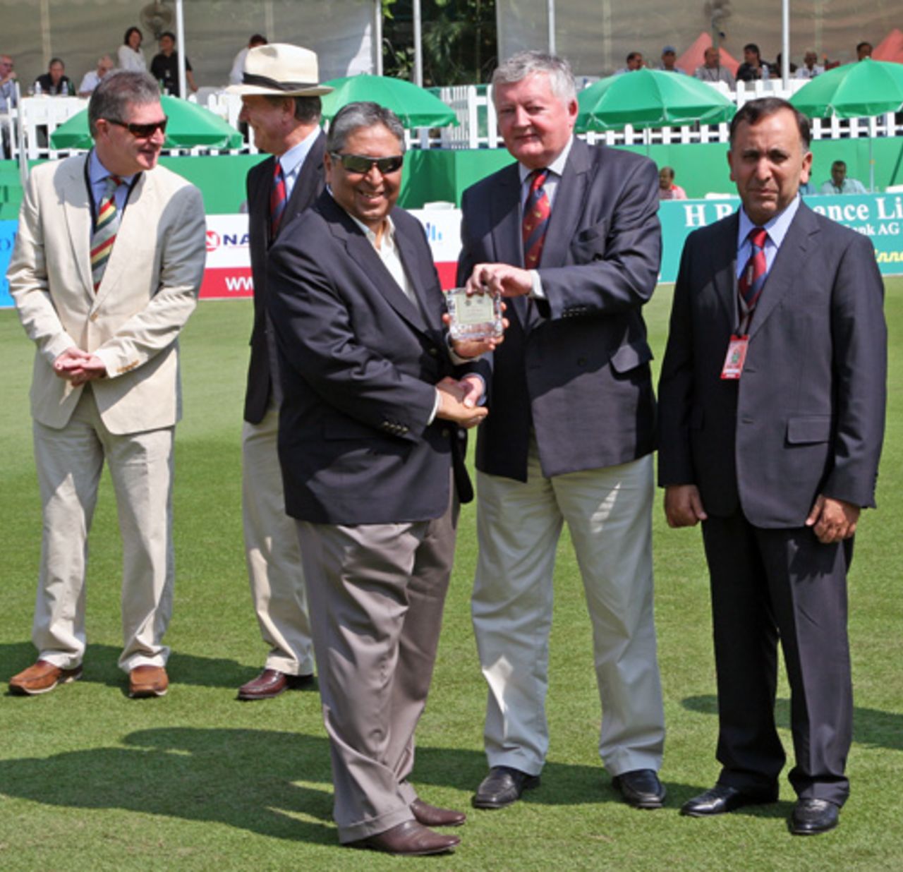 Papu Butani is presented with his HKCA Honorary Life Member Award by ICC President David Morgan. Also in the picture (from left to right) are HKCA Hon. Secretary John Cribbin, former HKCA President Terry Smith and current HKCA President Capt. Saleem