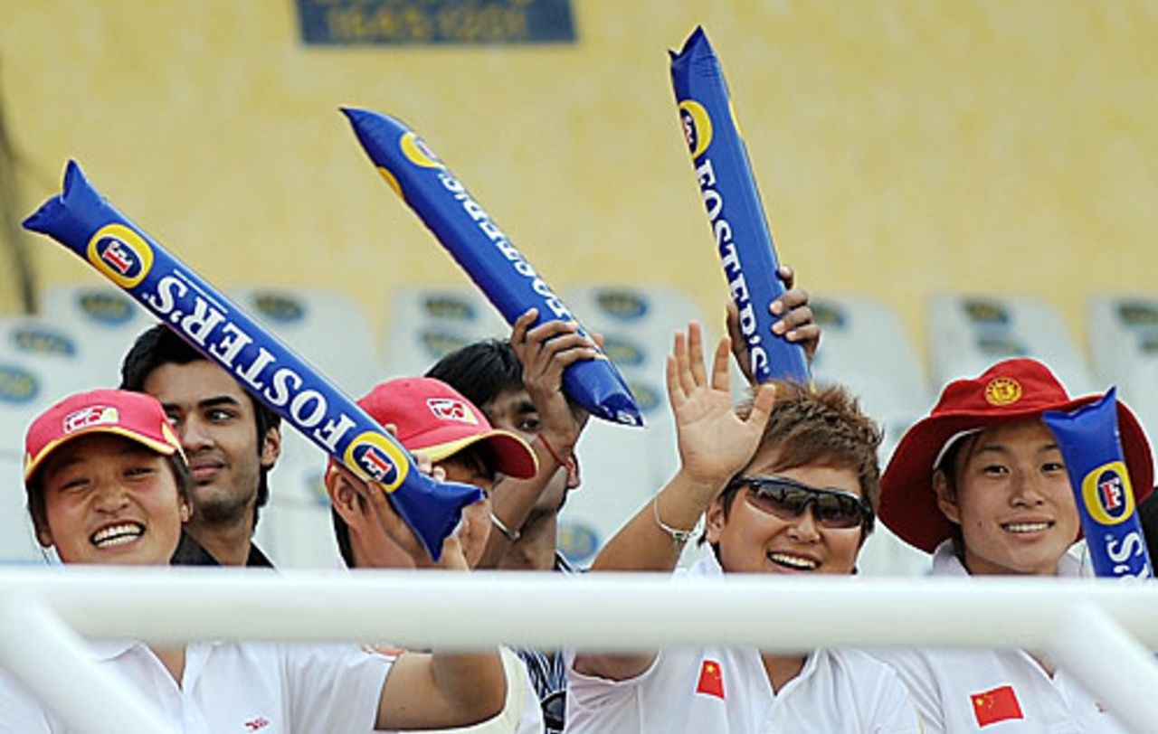 Members of the Chinese women's team catch the action in Mohali, India v Australia, 4th ODI, Mohali, November 2, 2009 