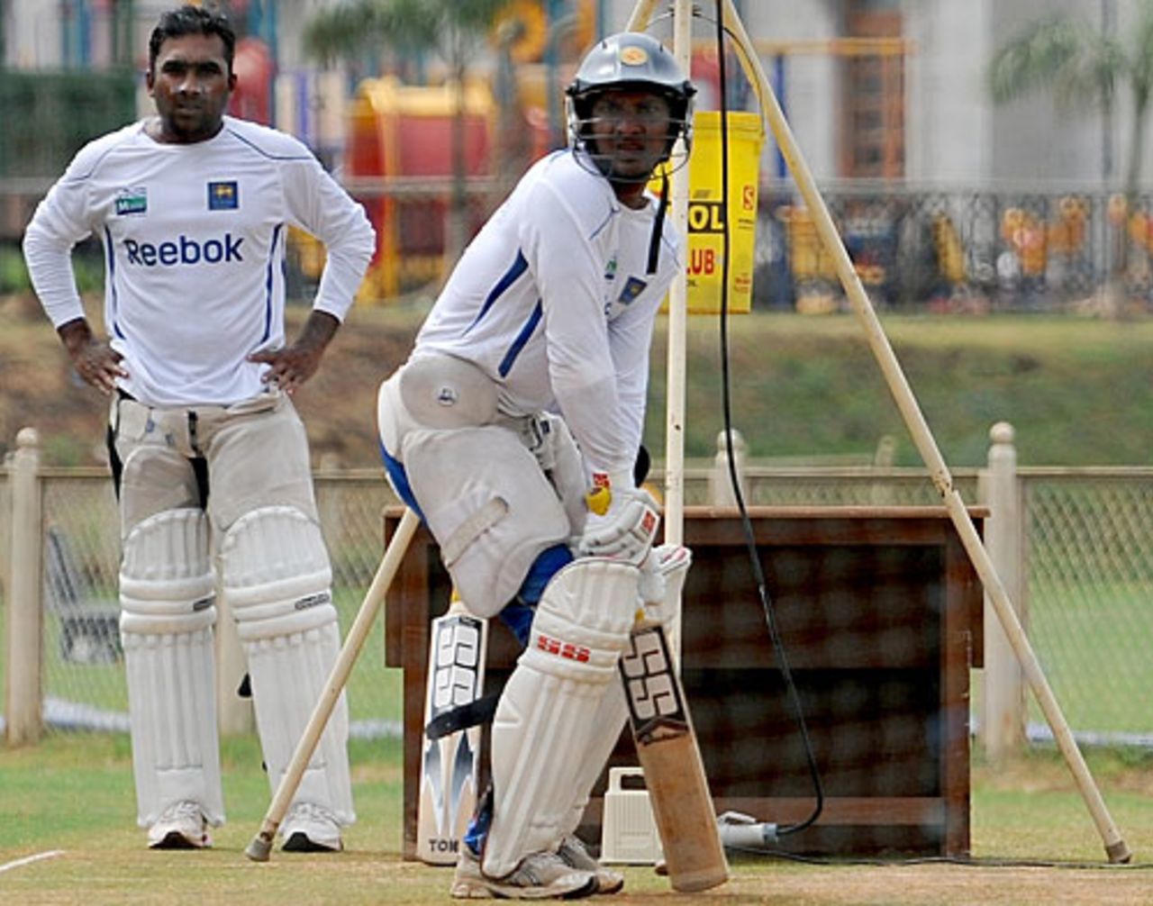 Kumar Sangakkara takes guard as Mahela Jayawardene awaits his turn at the nets, Mumbai, November 9, 2009