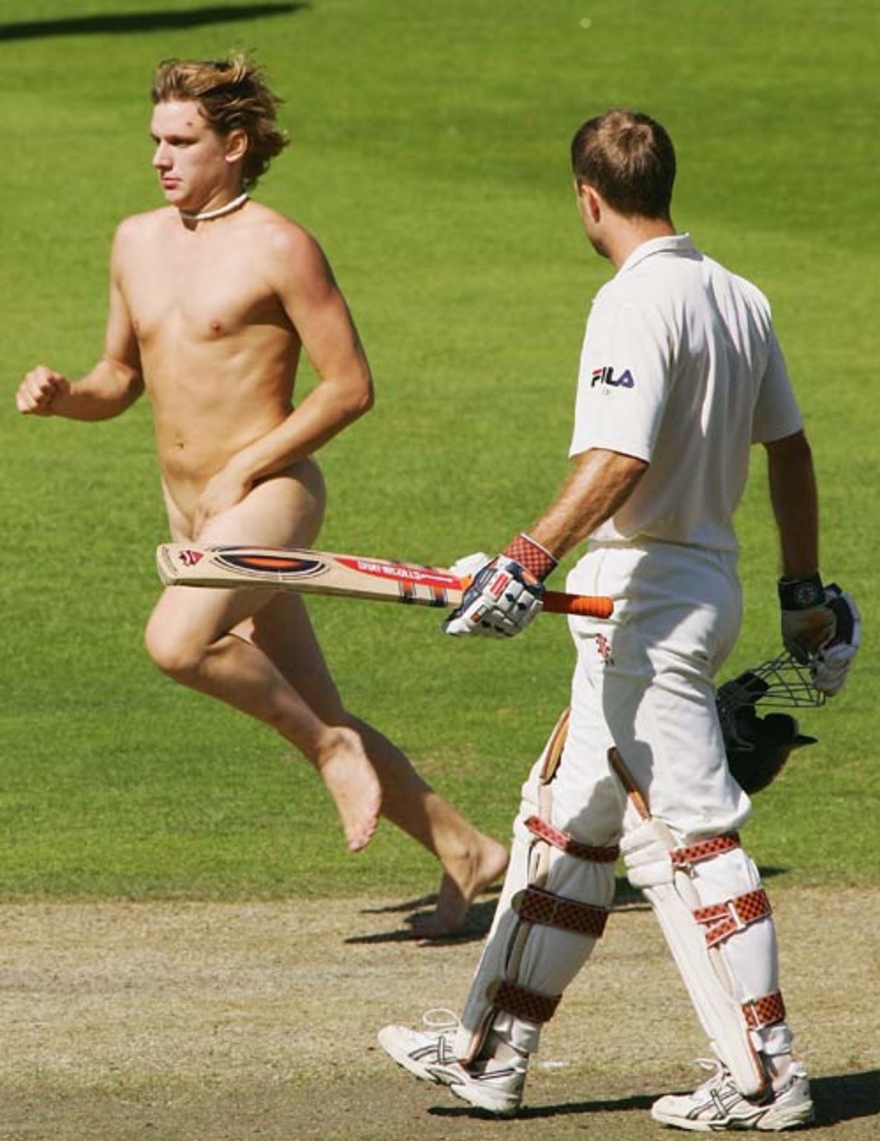 Simon Katich looks on as a streaker runs by, New Zealand v Australia, first Test, Christchurch, 12 March 2005