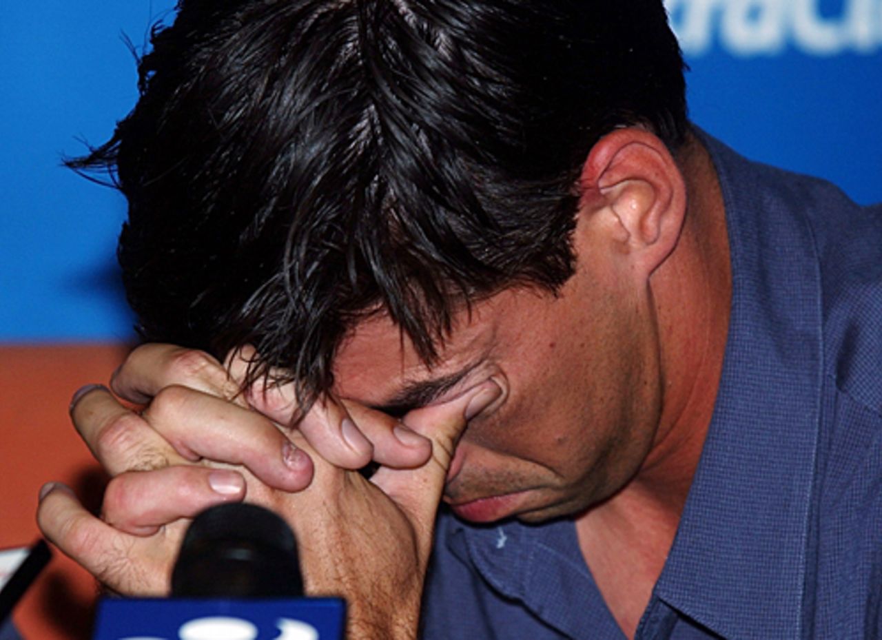 New Zealand captain Stephen Fleming tries to hold back tears at a press conference at Auckland Airport. The New Zealand team returned from Pakistan after a bomb blast outside their Karachi hotel caused the tour to be cancelled just prior to the second Test. 10 May 2002.