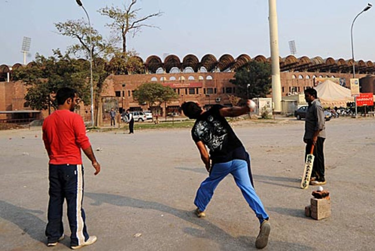A game of cricket outside the Gaddafi Stadium in Lahore, Lahore, November 21, 2009
