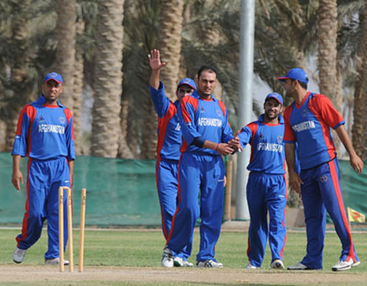 Afghanistan players celebrate a wicket on the opening day of the ACC Twenty20 Cup in the UAE, November 23, 2009