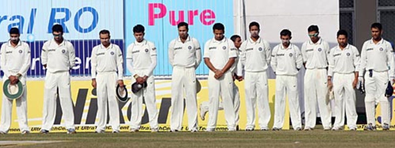 The Indians keep a moment's silence before the start of play on the first anniversary of the Mumbai terror attacks, India v Sri Lanka, 2nd Test, Kanpur, 3rd day, November 26, 2009

  