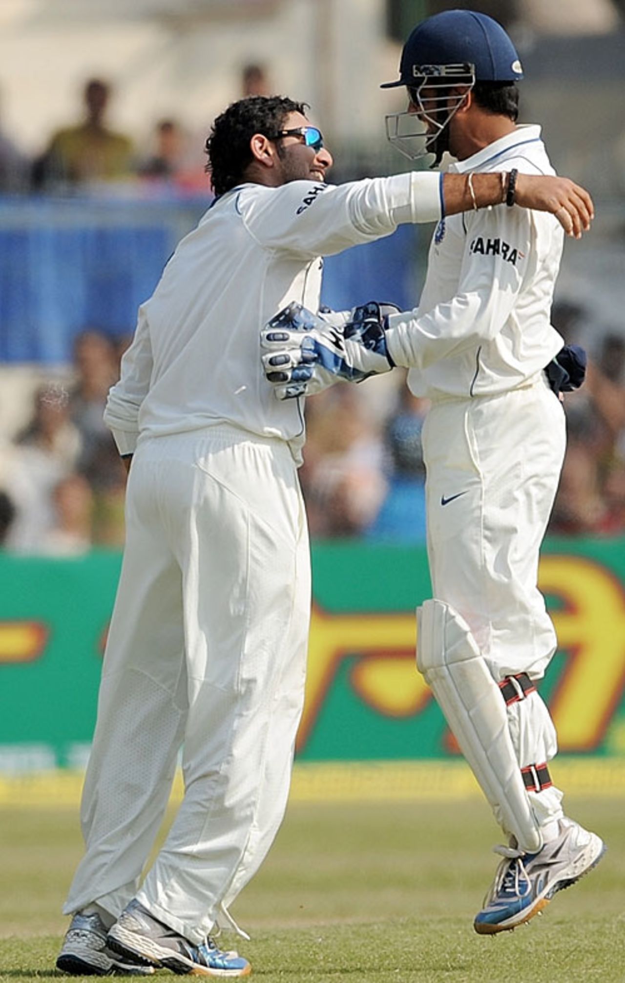 Yuvraj Singh and MS Dhoni celebrate the dismissal of Ajantha Mendis, India v Sri Lanka, 2nd Test, Kanpur, 4th day, November 27, 2009
