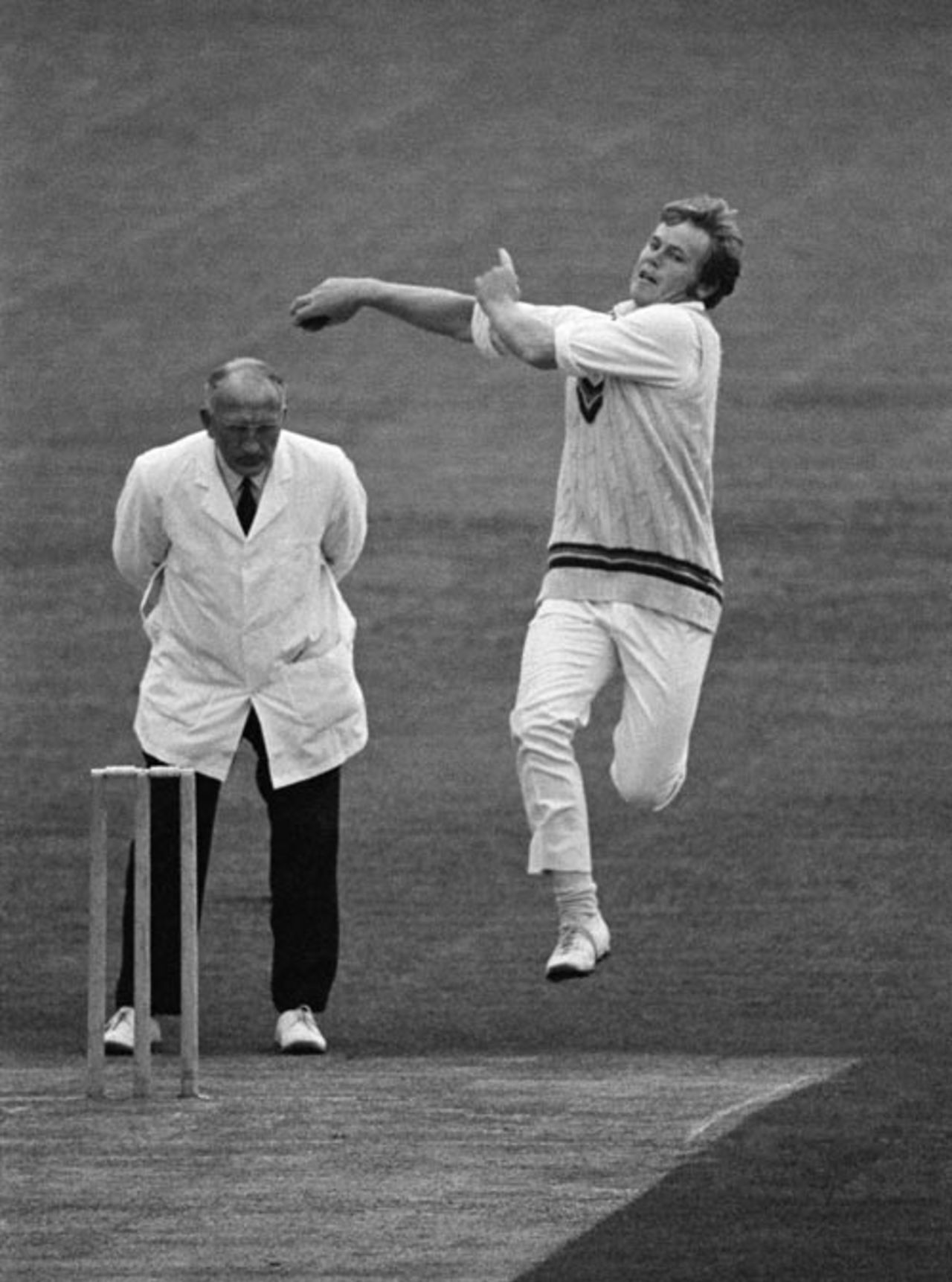 Mike Procter bowling as umpire Tom Spencer looks on, Gloucestershire v Northamptonshire, County Ground, Northampton, 21 June 1971